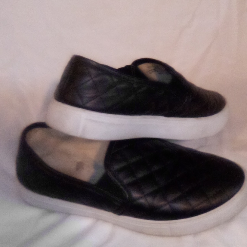 Black and white slip on shoes